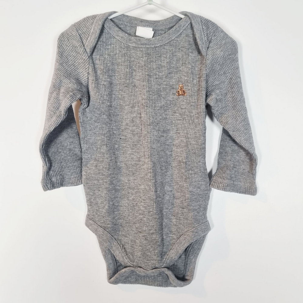 6-12M
Grey Bodysuit